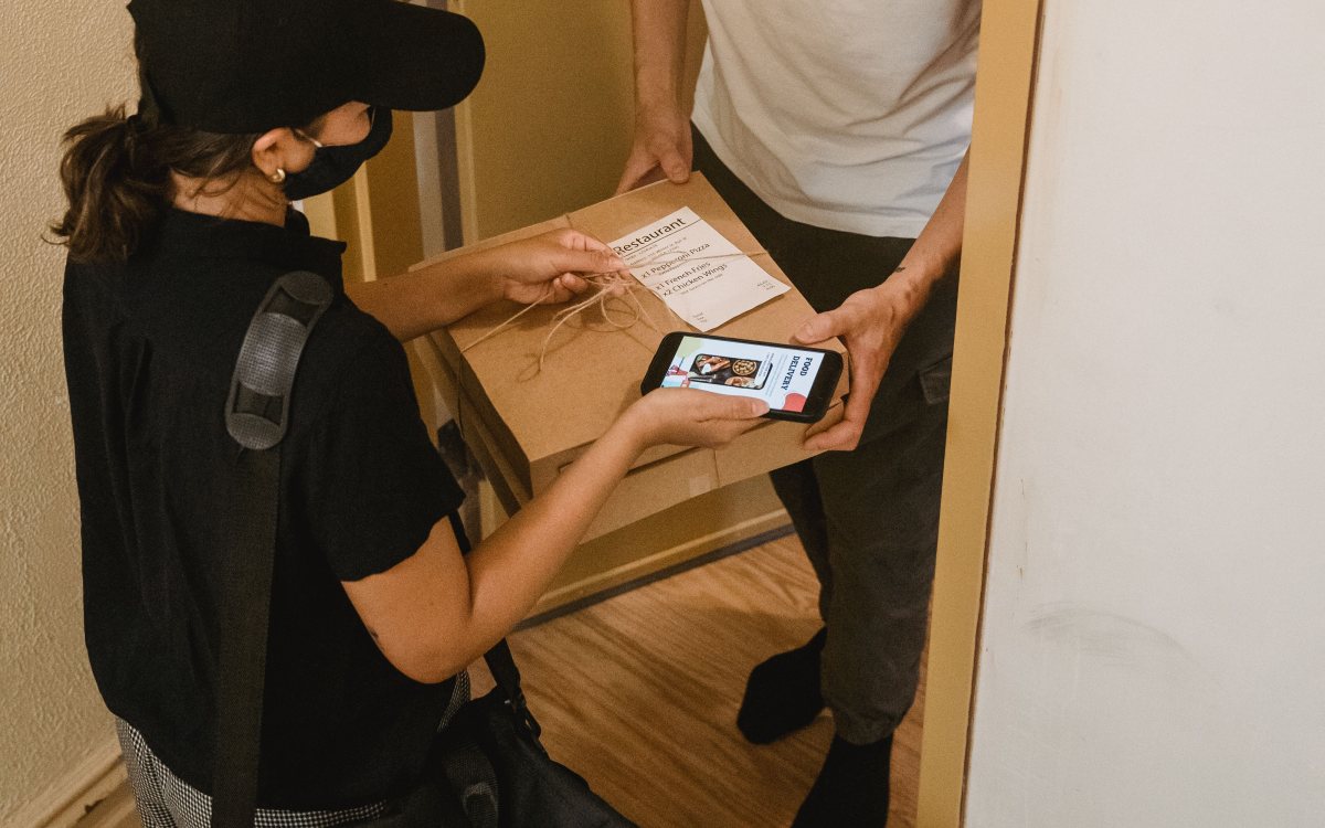 Signing for a Zedex delivery at the door